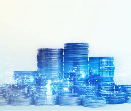 Double exposure of city and rows of coins for finance and banking concept