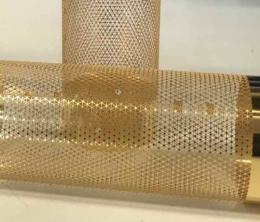 Finely etched, gold-coloured cylindrical components