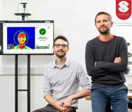 Spookfish directors John Robinson and Jouni Ronkainen pictured in front of a screen displaying their fever detection technology